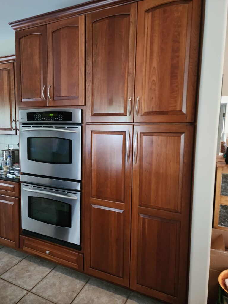 Cherry kitchen cabinets before painting in Ada, MI